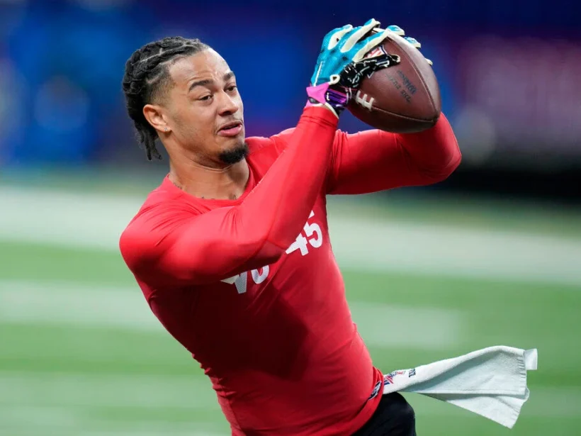 Jaxon Smith-Njigba catches a pass during a drill at the NFL Combine